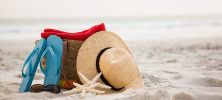 Bag And Beach Accessories Kept On Sand