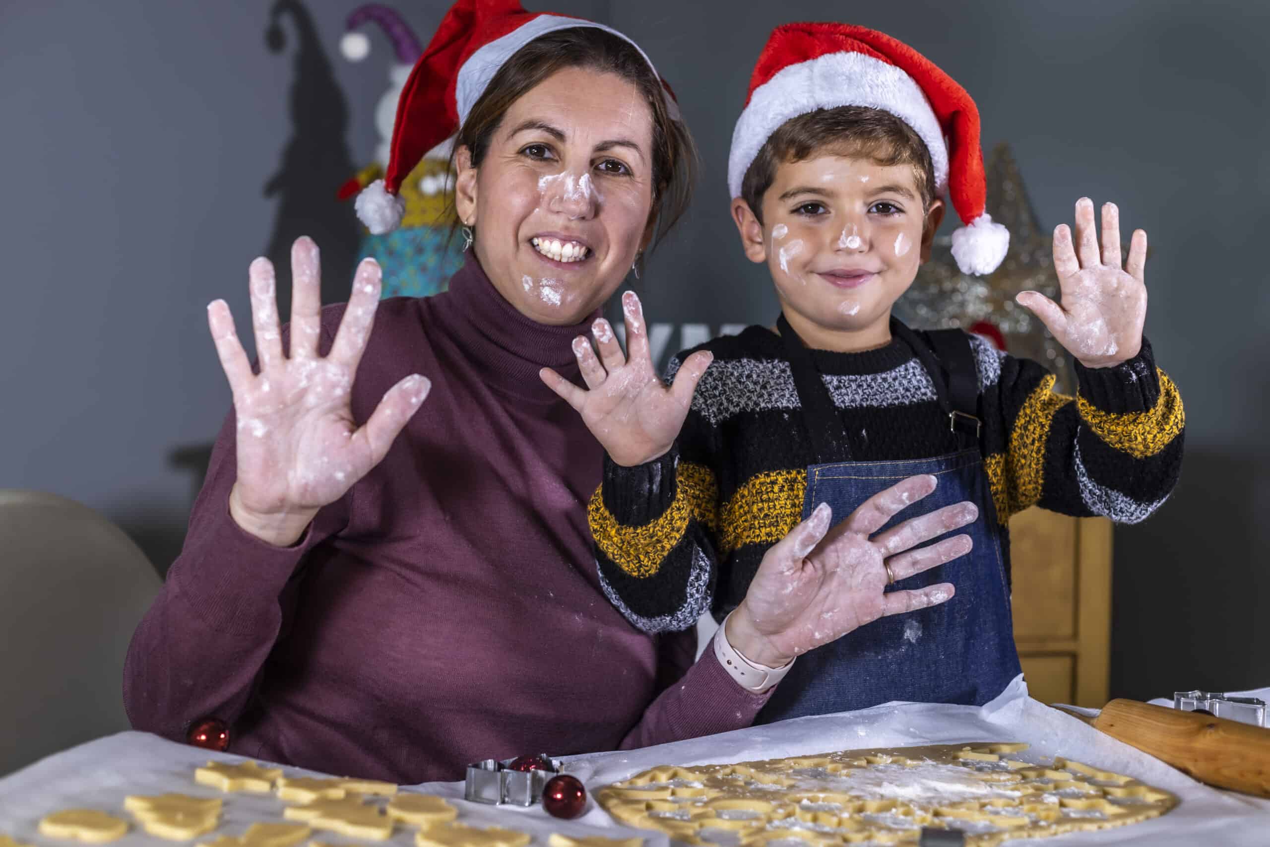 Mother And Son Making Cookies And Playing With Flour On Christmas