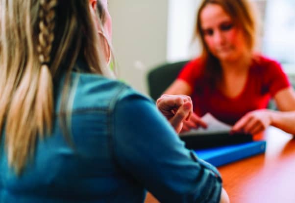 A Social Worker Interviewing A Patient Or Client