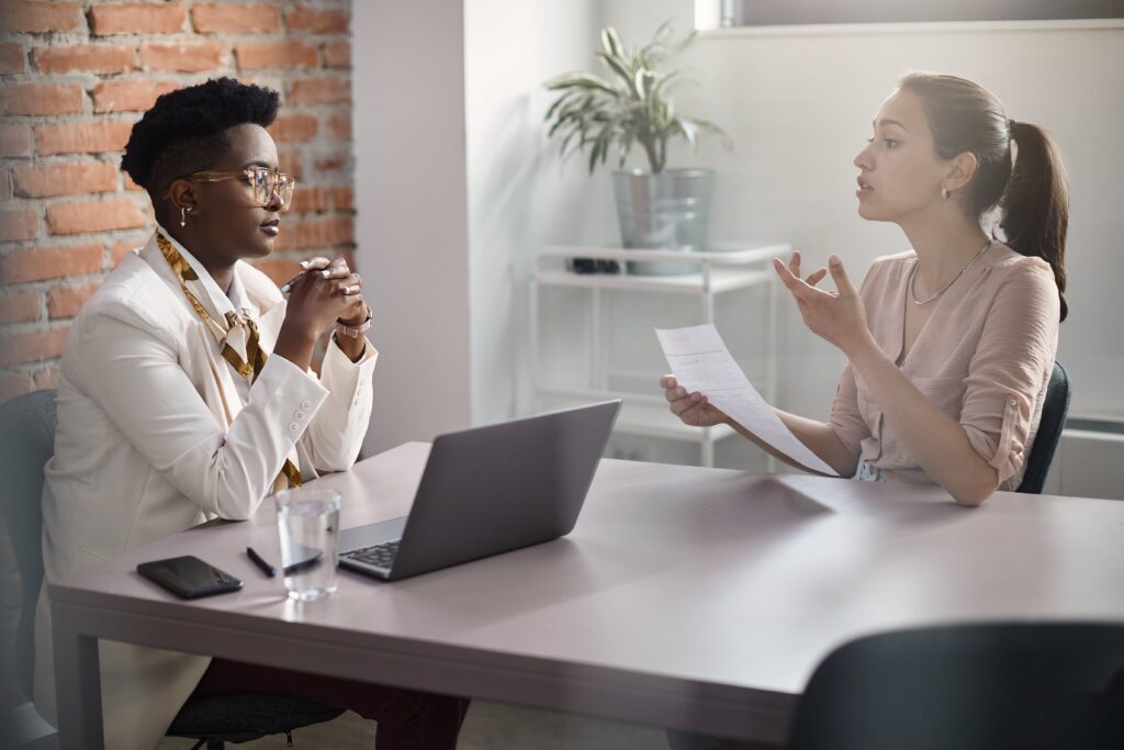 Young Woman Communicating With Black Human Resourc 2023 11 27 05 10 15 Utc Min