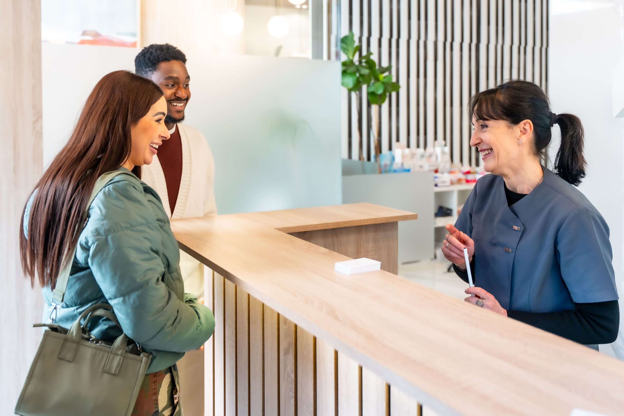 Couple Smiling At Receptionist In Dental Clinic 2025 05 07 18 52 46 Utc (1)