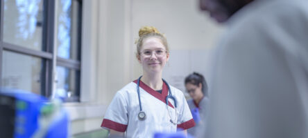 Portrait Of Smiling Nurse On Hospital Ward