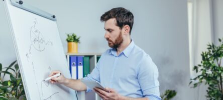 Young Businessman Writing On White Board With Mark 2025 03 28 10 49 46 Utc (1)